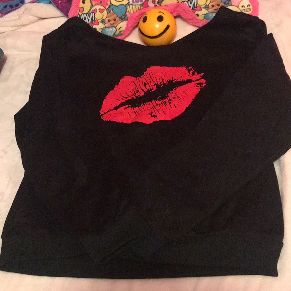 Black stretchy shirt with a red mouth on it